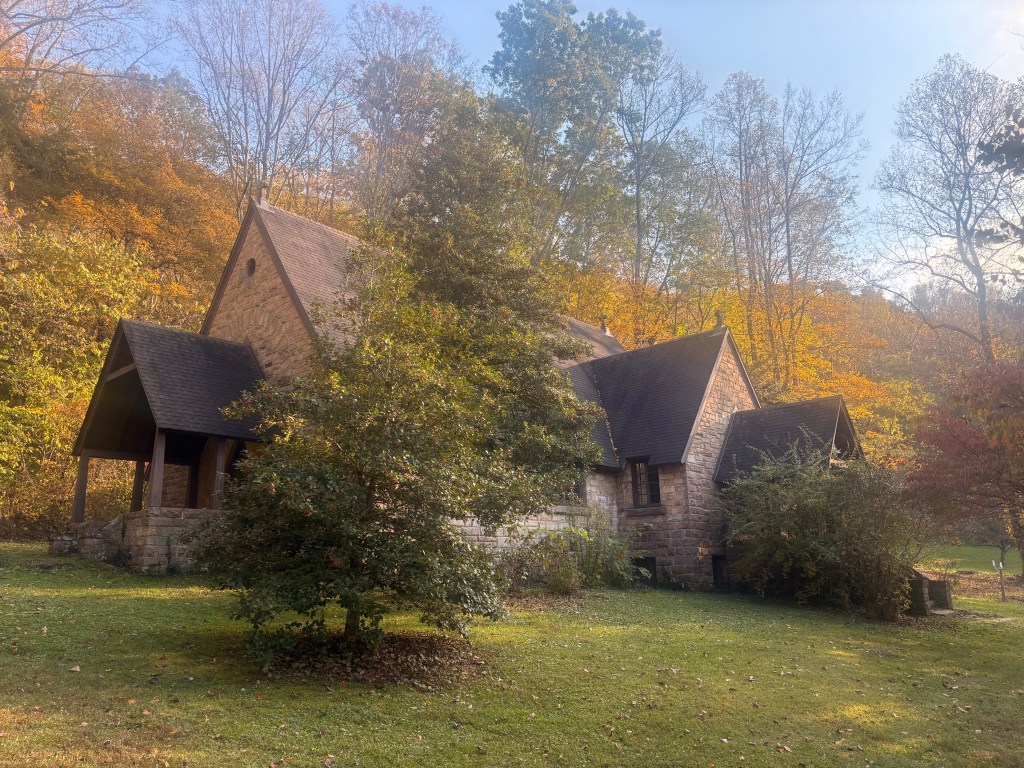 A small chapel on a hillside. The trees are just beginning to turn golden.